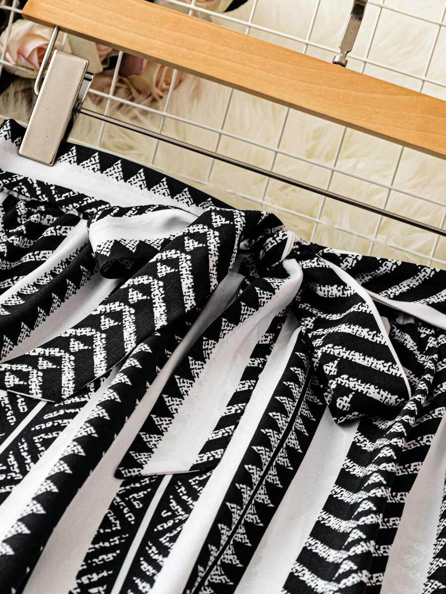 SHEIN LUNE Pantalones anchos de cintura elástica con estampado todo sobre para vacaciones informales