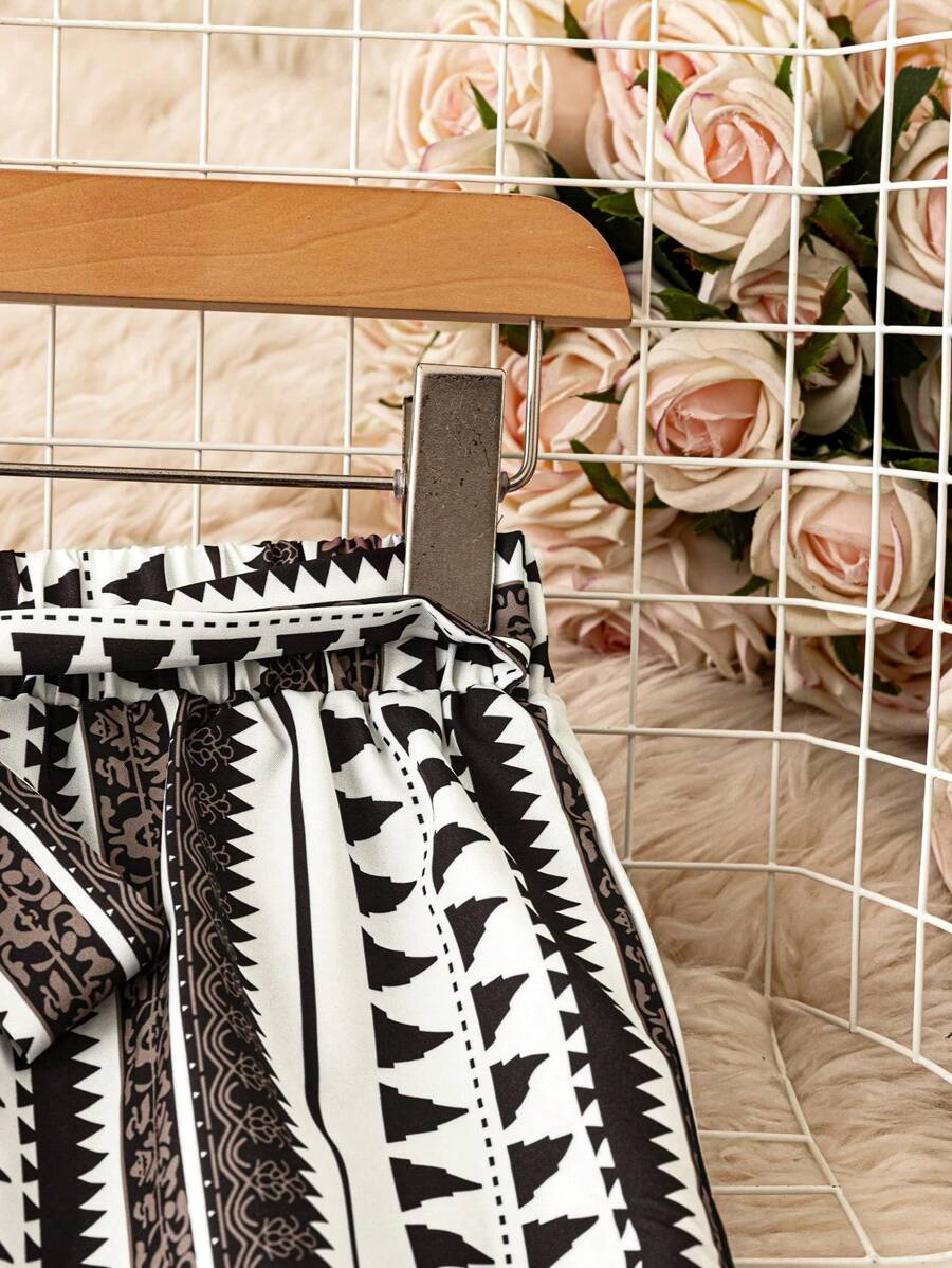 SHEIN LUNE Pantalones anchos de cintura elástica con estampado todo sobre para vacaciones informales