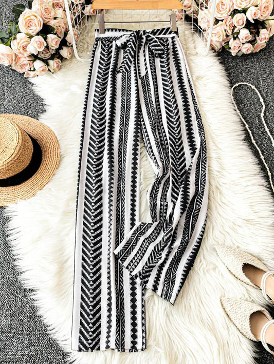 SHEIN LUNE Pantalones anchos de cintura elástica con estampado todo sobre para vacaciones informales