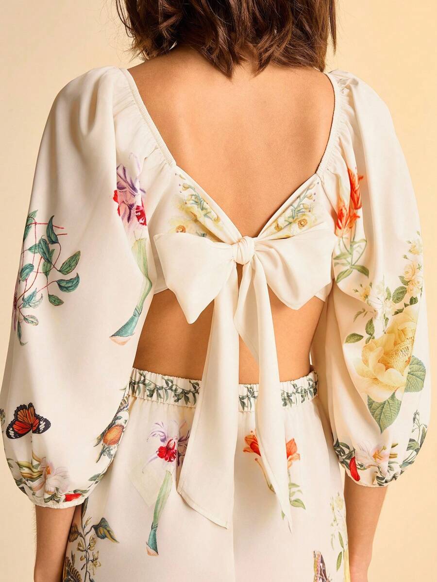 CAJUNI Mono de mujer con estampado floral tropical bohemio, cintura hueca con nudo, mangas abullonadas y espalda descubierta