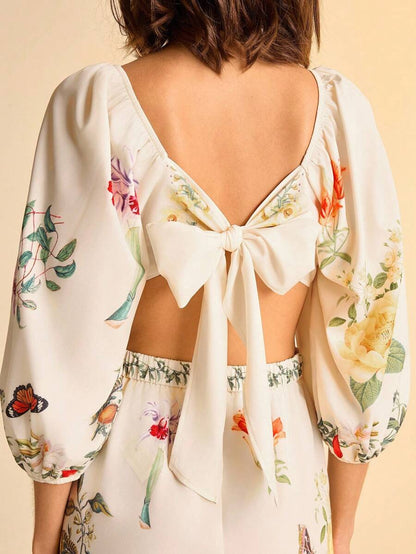 CAJUNI Mono de mujer con estampado floral tropical bohemio, cintura hueca con nudo, mangas abullonadas y espalda descubierta