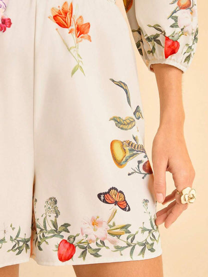 CAJUNI Mono de mujer con estampado floral tropical bohemio, cintura hueca con nudo, mangas abullonadas y espalda descubierta
