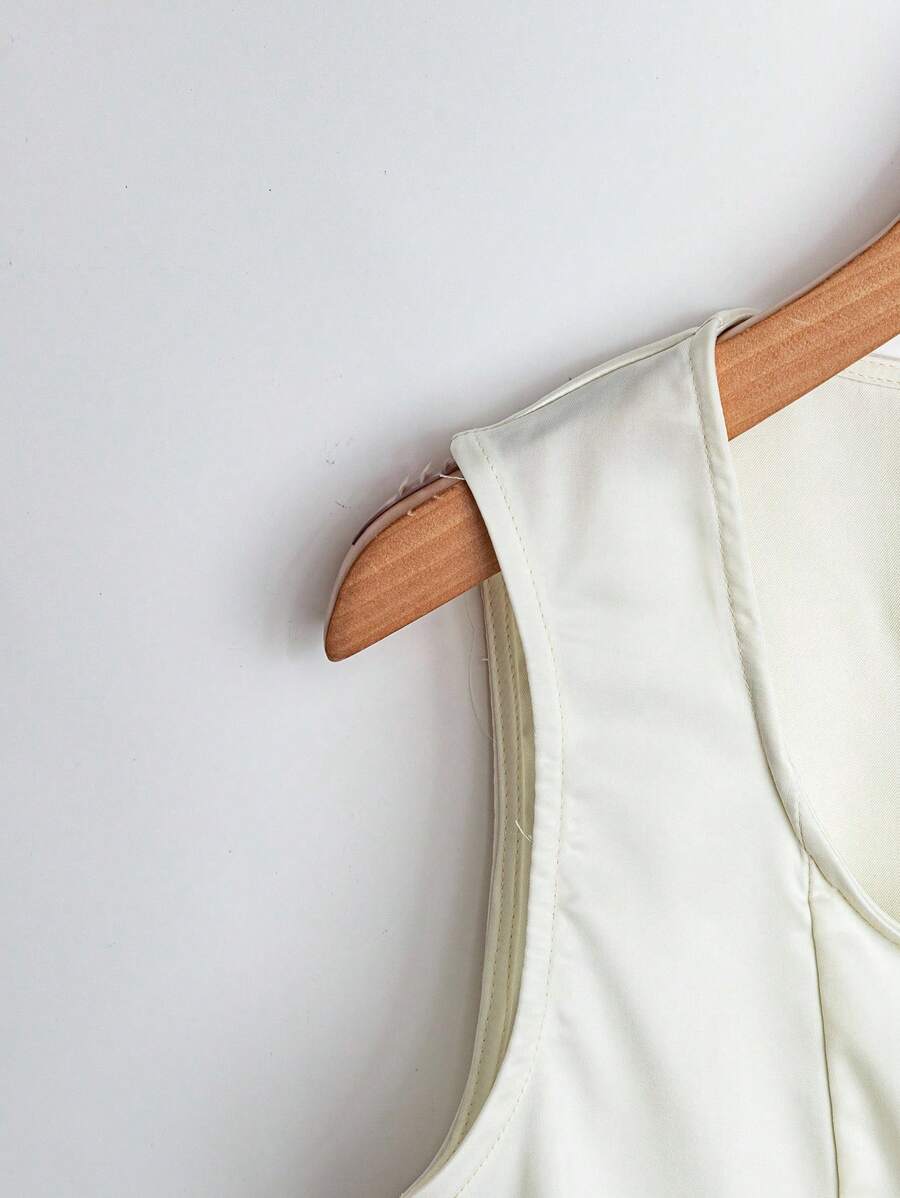Franclia Blusa de mujer casual y elegante de unicolor, sin mangas y con botones frontales
